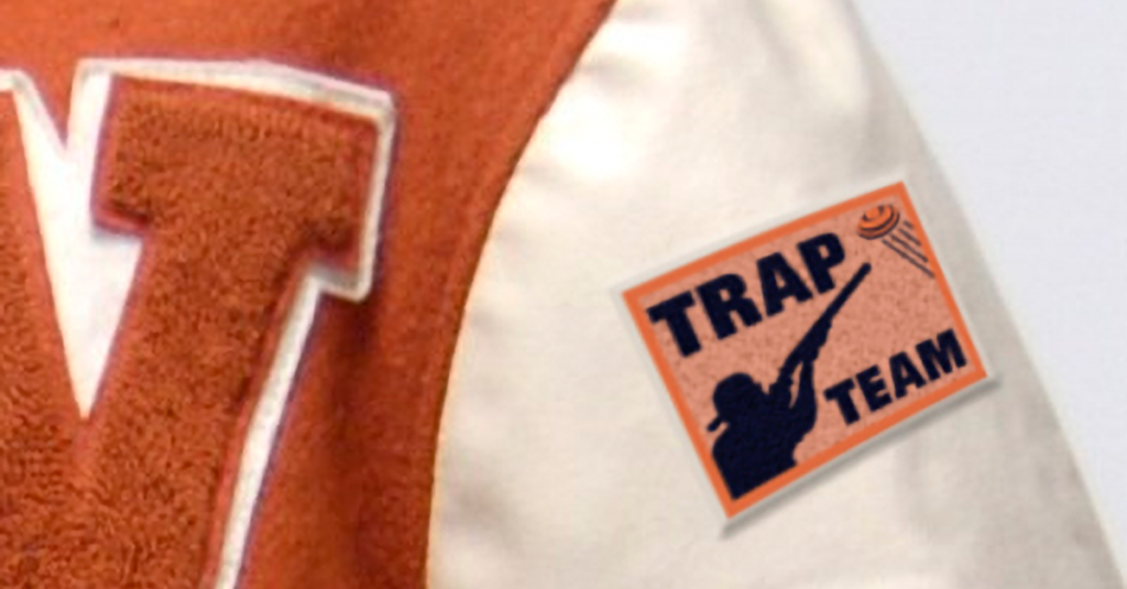 A zoomed in shot of a letterman jacket with a Tram Team patch on it.